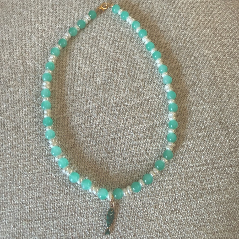 Green bead necklace with fish charm